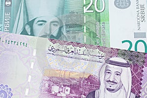 Serbian money with a Saudi Arabian bank note