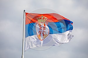 Serbian national flag on wind, outdoor