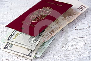 Serbian passport and money on table