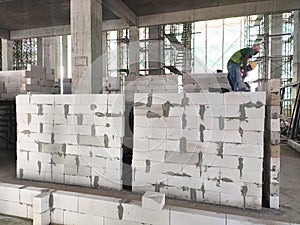 Blockwork by construction workers at the construction site.