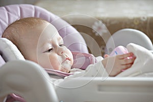 Serene baby in a stroller