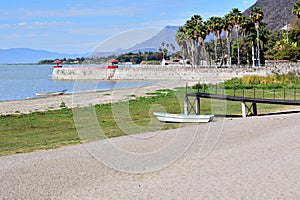 Serene Beachfront and Dock View at Lake Chapala, with a solitary boat photo