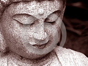 Serene Buddha Face looking down close up