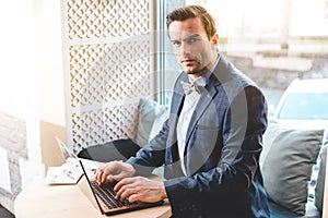 Serene businessman using notebook computer photo