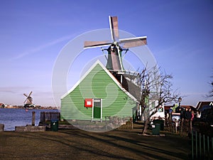 Serene countryside scene with a gracefully turning windmill