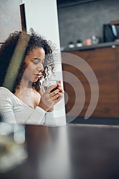 Serene female inhaling the aroma of coffee