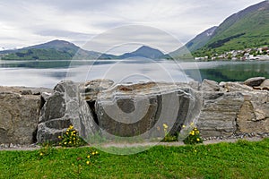 Serene fjord.View in the Heart of Lush Green Mountains During Early Morning