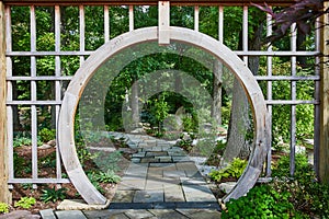 Serene Garden with Wooden Archway and Flagstone Path in Elkhart