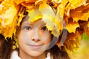 Serene girl with an autumn headwreath