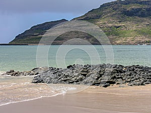 Serene image of water and mountain in Kauai, Hawaii