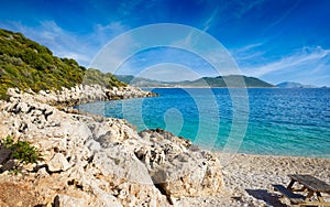 Serene Kas beach in Antalya Province of Turkey with clear Mediterranean sea