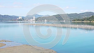 Serene Lakeside View with Mountains and Sky Reflection