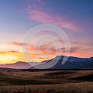 serene landscape scenery with fields and soft sunset