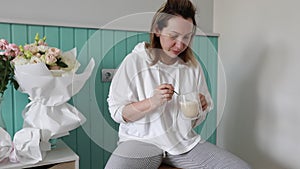 Serene Morning Routine: Woman Enjoying Coffee in a Cozy Kitchen Setting