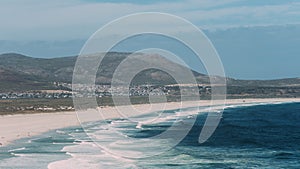 Serene Noordhoek Beach in South Africa With Pristine White Sands and Gentle Waves at Dusk