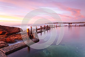 Serene pastel colours of early dawn morning light at Mahon Pool