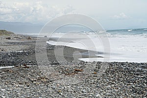 Serene rocky beach in Hokitika, New Zealand photo