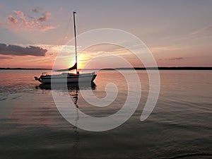 Serene Sailboat at Anchor at Sunset