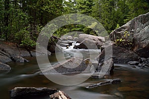 Serene Scenic Pike River Waterfall Through Large Granite Boulders Amberg Wisconsin