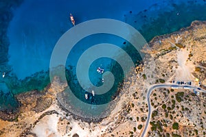 Serene sea bay with fishing boats, top view