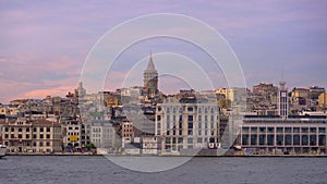 A serene slow-motion journey by boat offers a striking view of Istanbul's iconic Galata Tower, rising