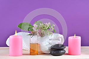 Serene Spa Delight: Pink Candles and Relaxation on a Wooden Desk