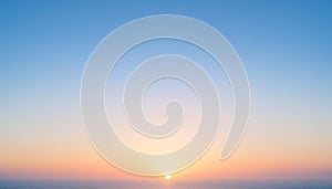 Serene Sunrise Over a Calm Ocean With Clear Blue and Orange Sky AI-GENERATED photo