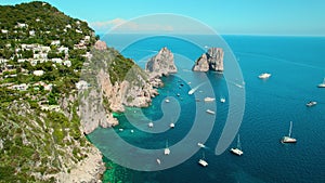 Serenity at Capri Island with Azure Sea Waters and Faraglioni Cliffs. Breathtaking view of Italian coastline dotted with