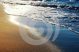 Serenity sand beach with waves. Sunny sea shore