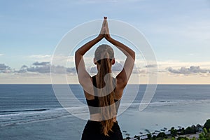 Serenity at Sunset: Yoga Overlooking the Ocean
