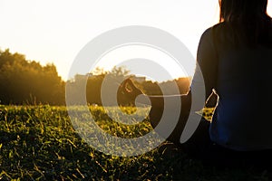 Serenity and yoga practice in autumn nature at sunset