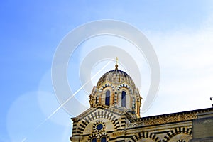 A series of 8 photos - a trace in the sky from the plane flying over Notre Dame de La garde Cathedral in Marseille, the Symbol of