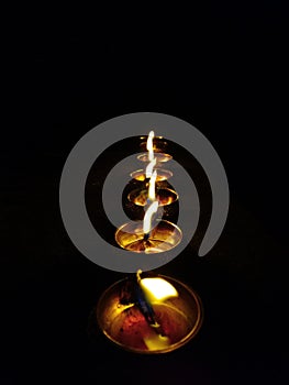 Series of Diya small lamp lit by oil and thread