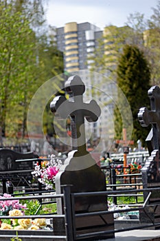 Series of monuments made of black gabbro-diabase granite on the graves of the deceased in a cemetery in Eastern Europe