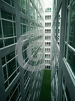 Series of narrow claustrophobia courtyard with glass window