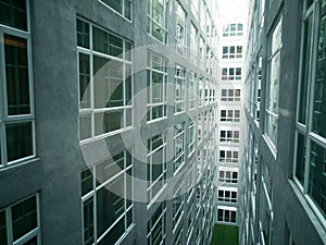 Series of narrow claustrophobia courtyard with glass window