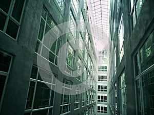 Series of narrow claustrophobia courtyard with glass window