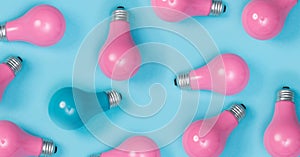 Series of painted pink light bulbs with a one out