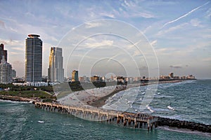 A series of photos of a cruise ship as it leaves the Port of Miami Cruise Terminal and heads for open water