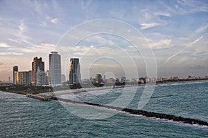 A series of photos of a cruise ship as it leaves the Port of Miami Cruise Terminal and heads for open water