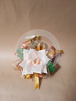 a series of ribbons and plastic flowers for parcel decoration or gifts