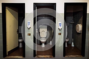 Series of three toilets placed in the company