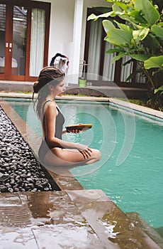 Series traveling girl in Asia. beautiful girl with long dark hair in swimming suit in beautiful nature place in Bali