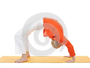 Series or yoga photos.woman in chakrasana pose photo