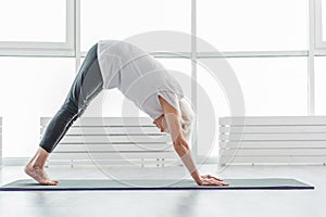 Serine mature lady doing yoga