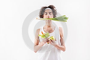 Serine slim young man with healthy food photo