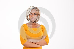 Serious african american woman standing with arms crossed