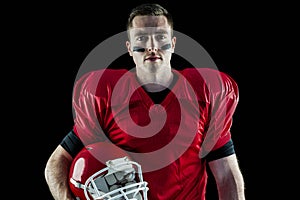 A serious american football player looking at camera