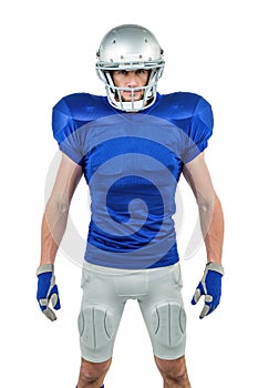 Serious American football player standing