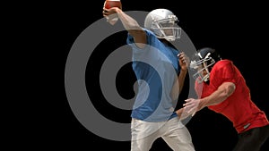 Serious american football player tackling for ball